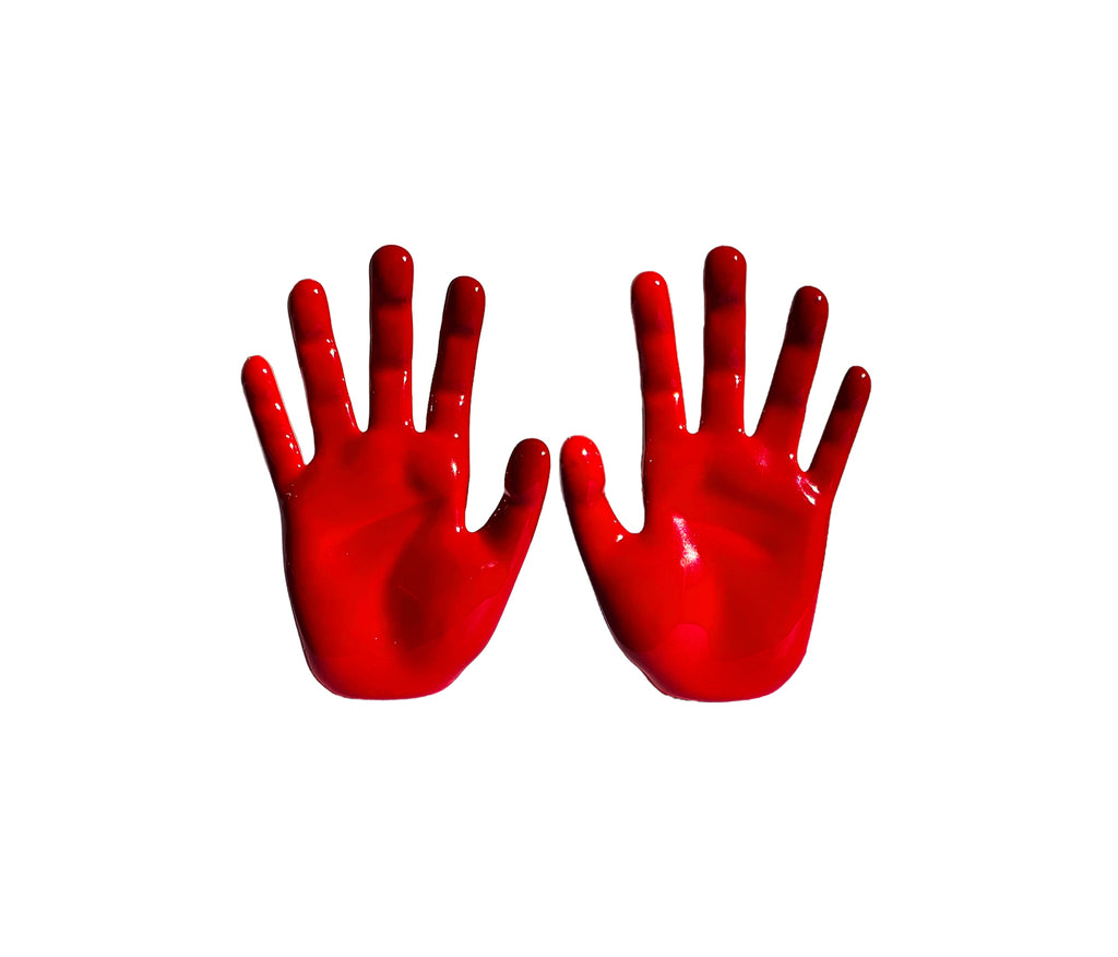 red hand jewelry, red enamel coated stud hand earrings with palm facing forward, right and left hand stand next to each other both hand painted in red enamel