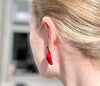 the devils hand jewelry, red enamel middle finger earring and red enamel ear cuff on ear at different angle